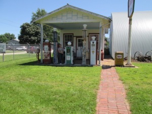 Across the street was a Phillips 66 gas station.  Along side the museum was a row of horse pulled farming equipment.